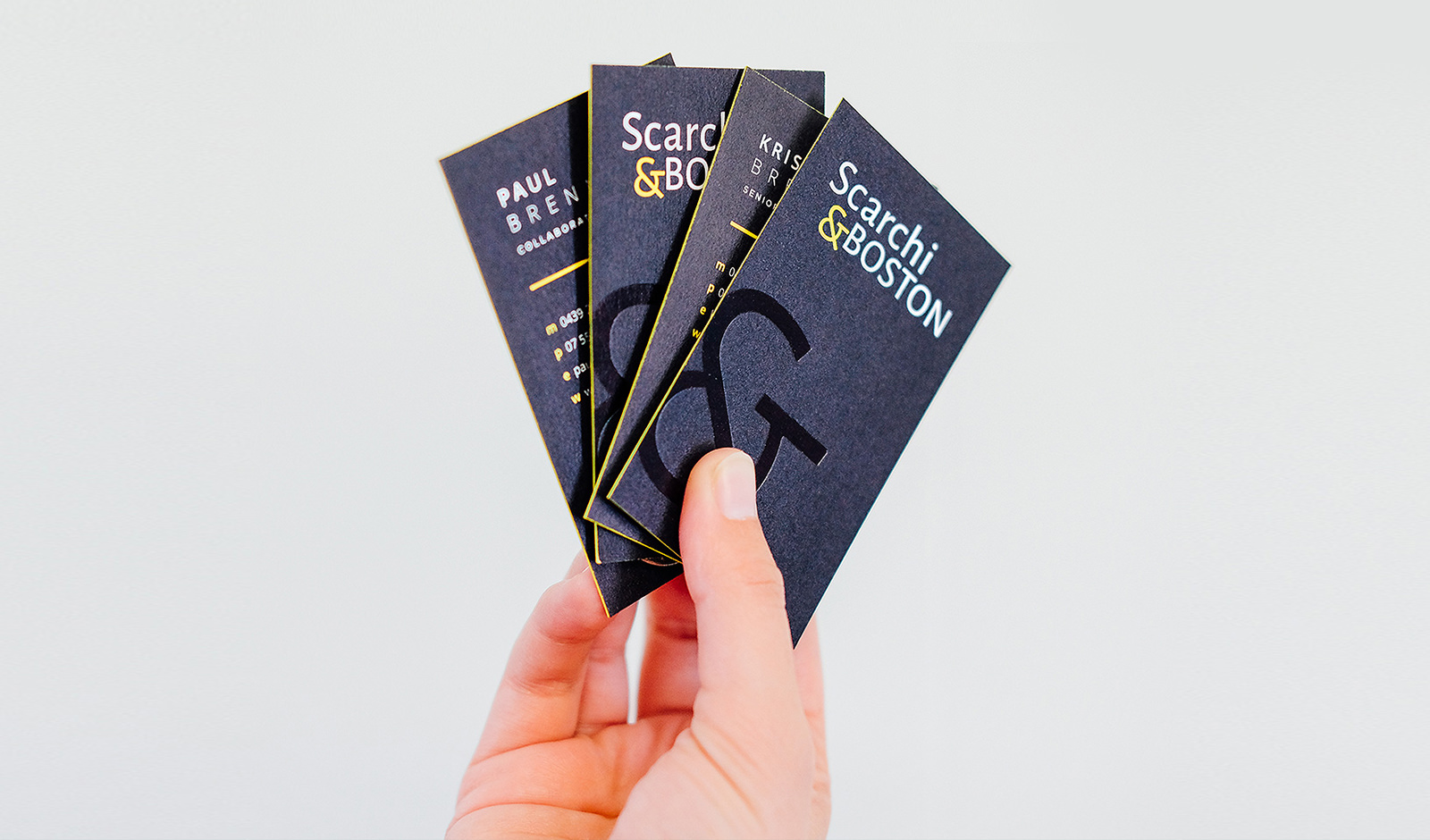 An image of letterpress and folied business cards with coloured edge