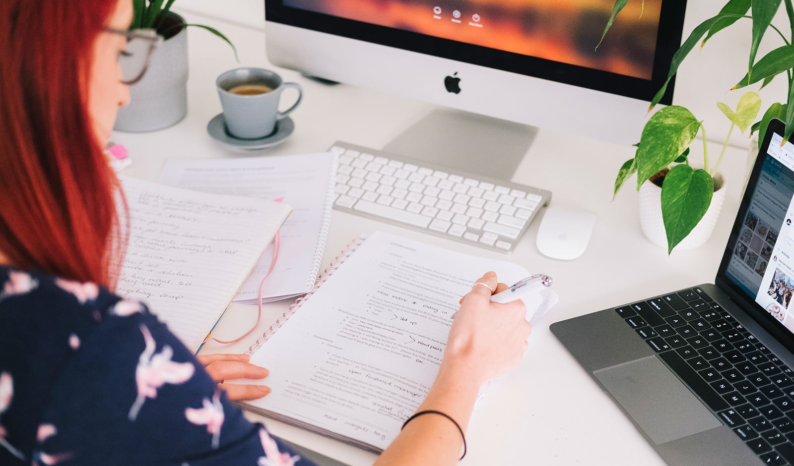 A woman reviewing her notes for copywriting