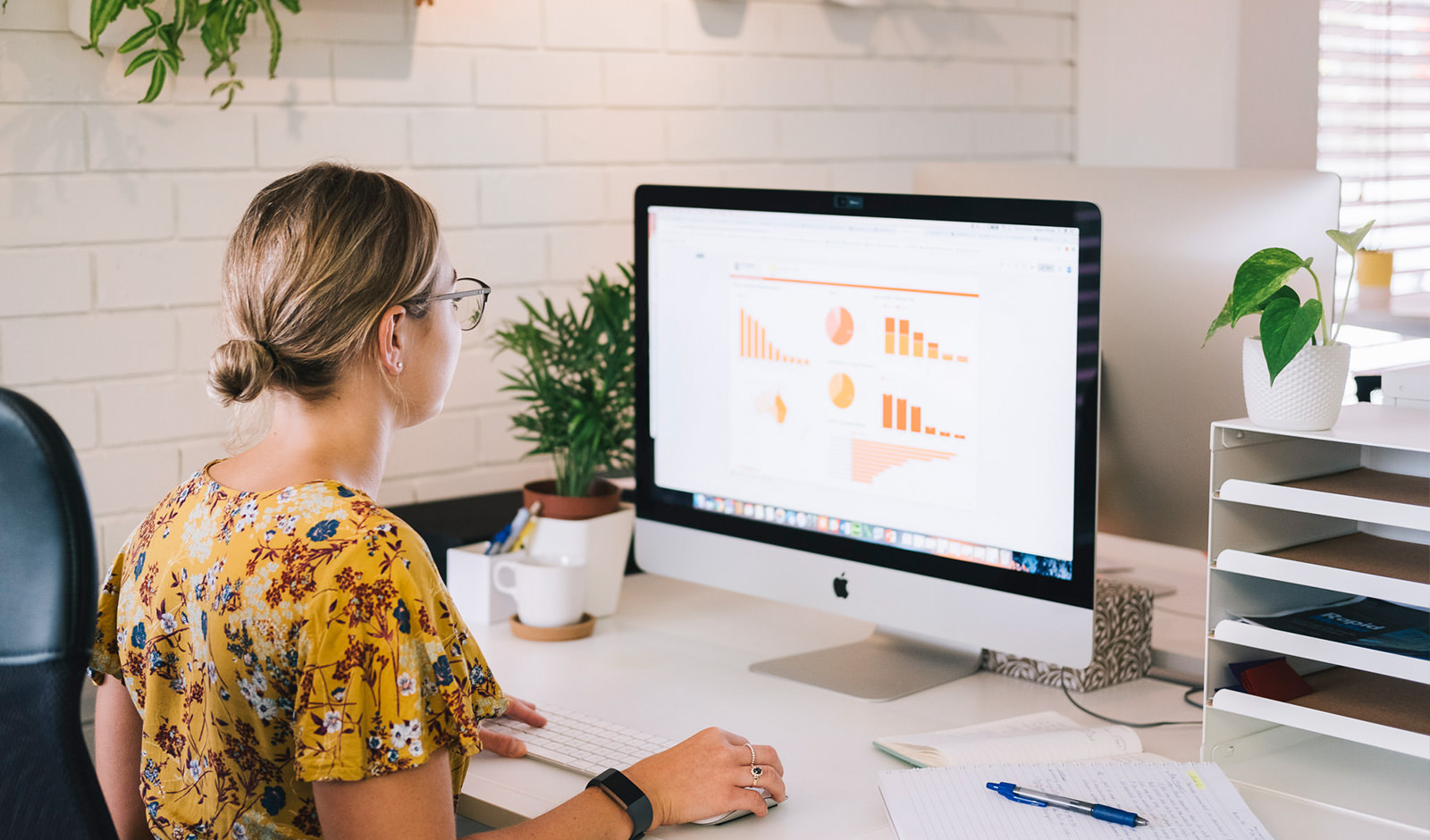 A woman building a report in Google Data Studios