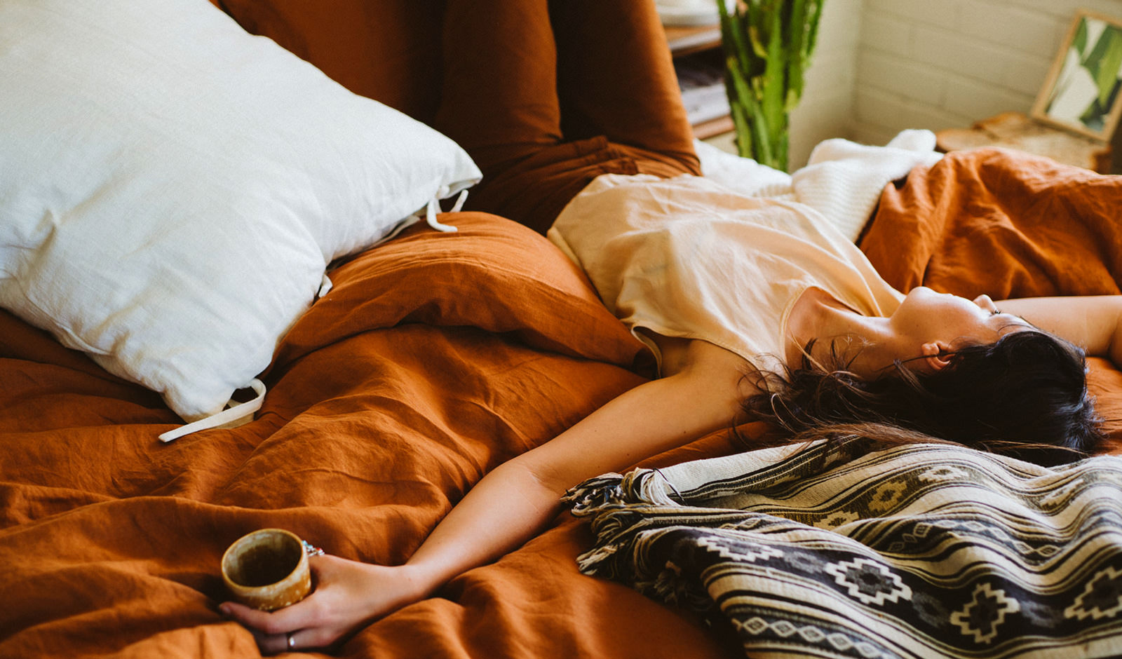 Girl lying on a bed during a photoshoot