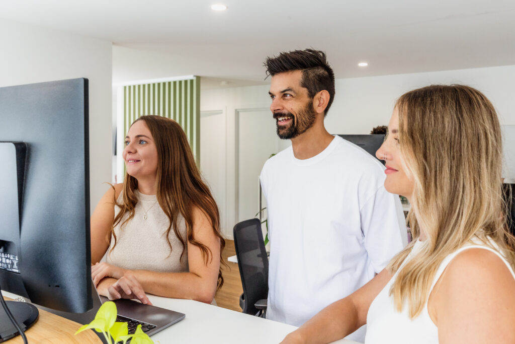 full service marketing agency team smiling in the office